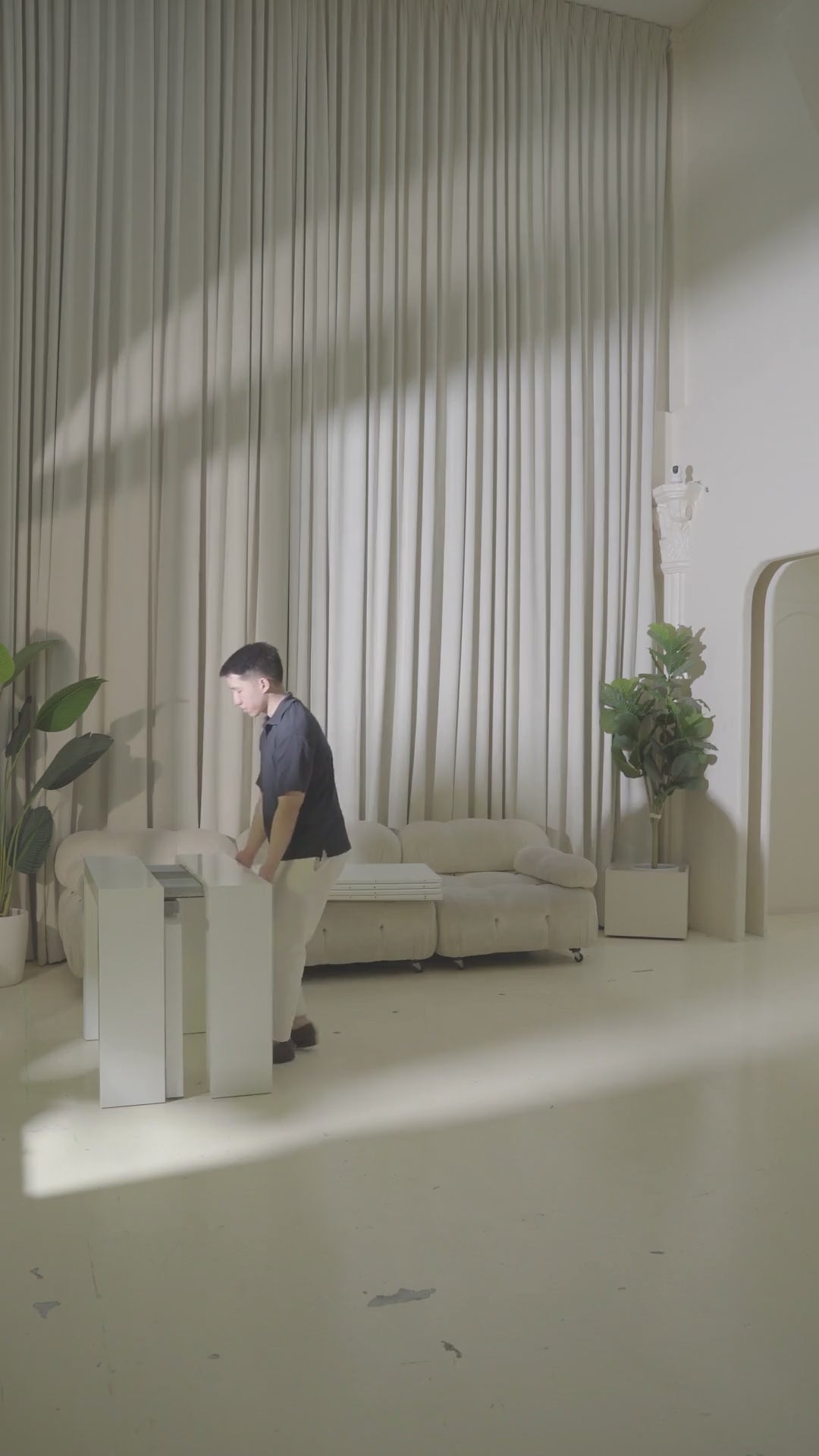 Load video: Person setting up expandable dining table